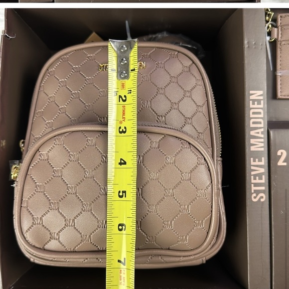 Steve Madden 2 piece gift set backpack and
wallet key chain